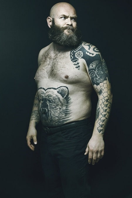 A picture of Darko Peric has a lot of tattoos.